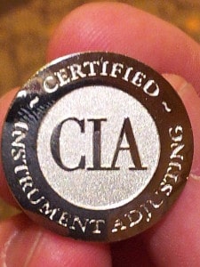 The certification lapel pin.