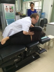 Back pain patient receiving a classic low back side posture adjustment.