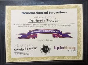 NeuroMechanical Innovations certificate awarded to Dr. Justin Trosclair for expertise in instrument adjusting and chiropractic techniques, highlighting advanced spinal care.