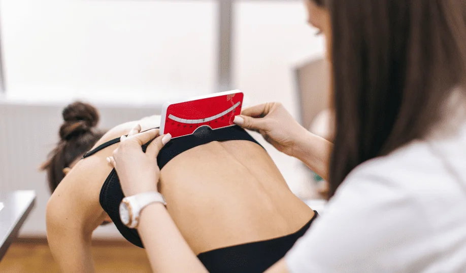 Getting Ahead of the Curve: The Importance of Early Scoliosis Detection - for patients 2 Diagnosing scoliosis with a scoliometer at the Scoliosis Center of LA & Chiropractic. Personalized care for scoliosis treatment and chiropractic services in Louisiana.