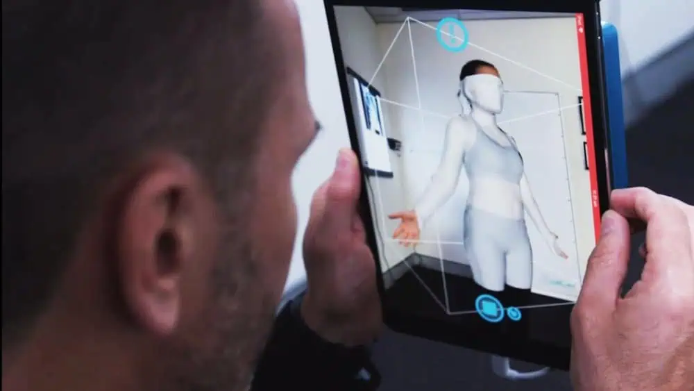 ScoliBrace 3d Custom Bracing 11 Doctor using a tablet to scan a 3D model of a patient with scoliosis for custom bracing at the Scoliosis Center of LA.