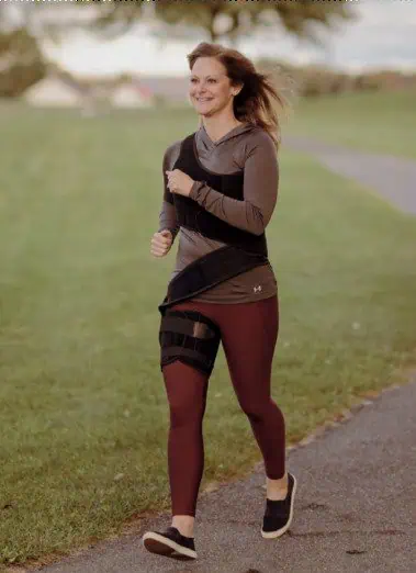 Active woman walking outdoors, promoting scoliosis health and spinal wellness, with a focus on scoliosis treatment options like braces and exercises.